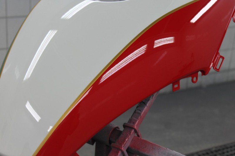 Red and white car part painting